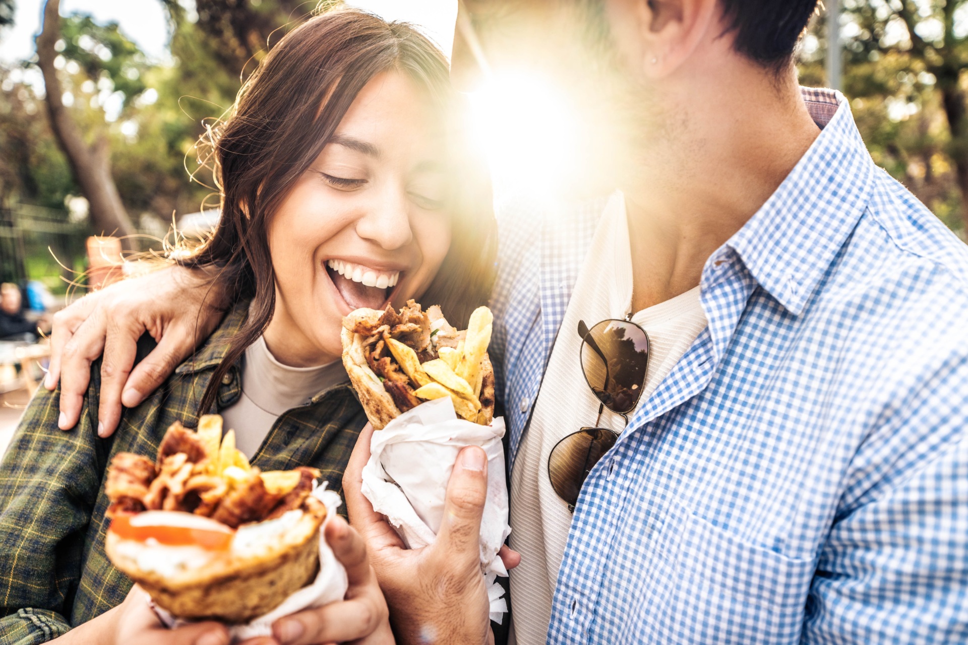 Happy,Couple,Eating,Gyros,Souvlaki,Wrapped,In,A,Pita,,Greek